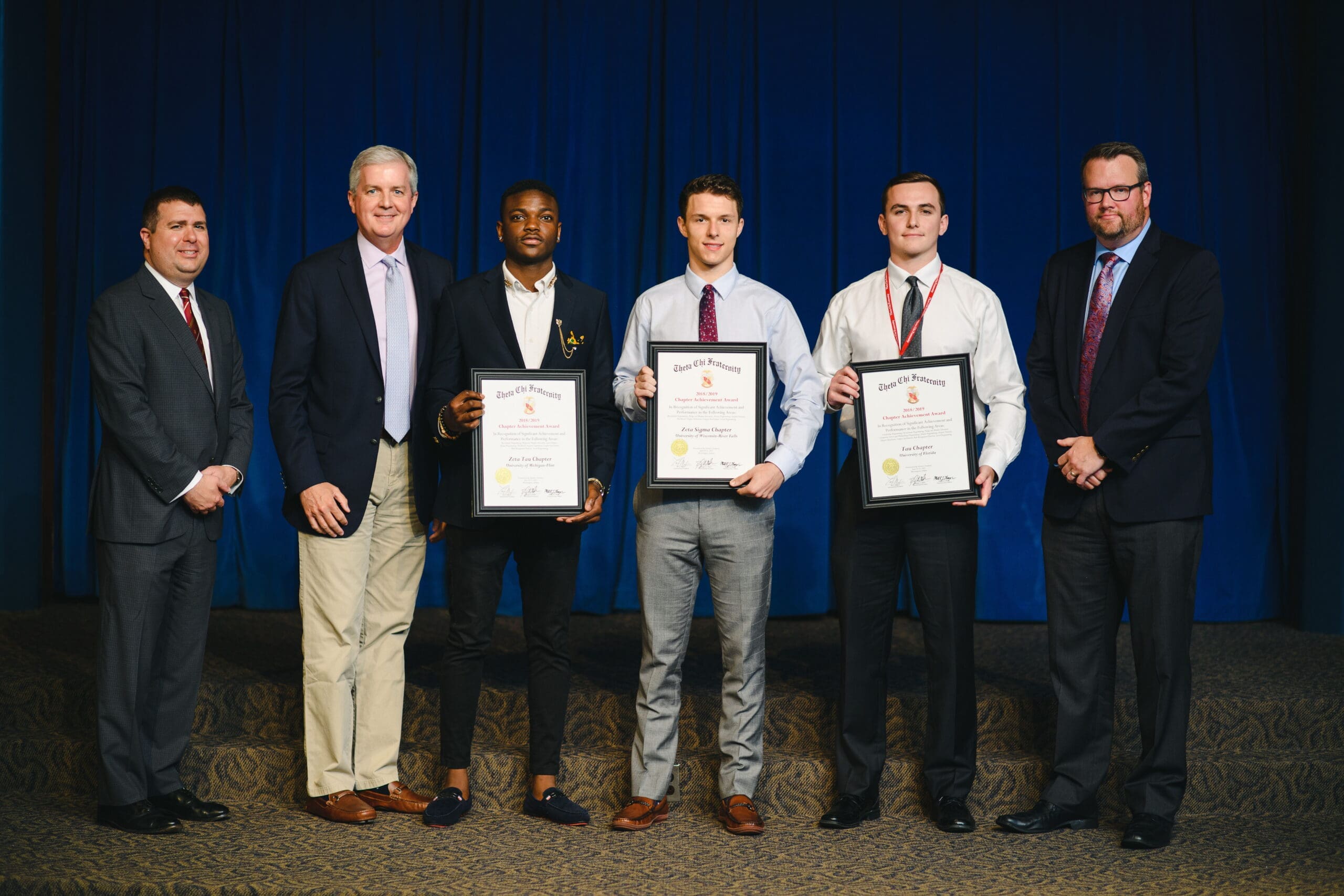 2018/2019 Achievement Award Students receiving awards at a formal ceremony.
