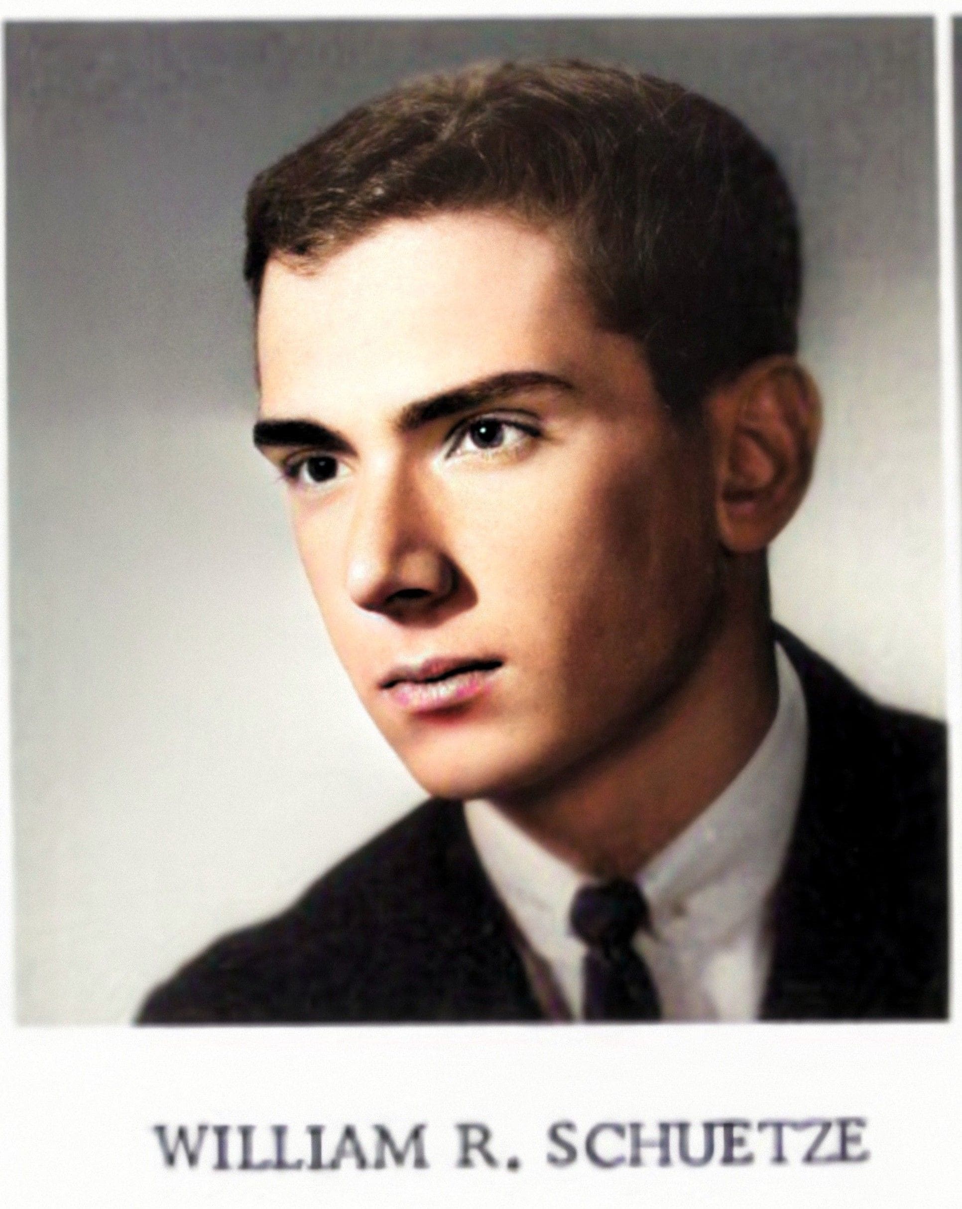 Bill Schuetze 1964 Young man in formal attire, serious expression.
