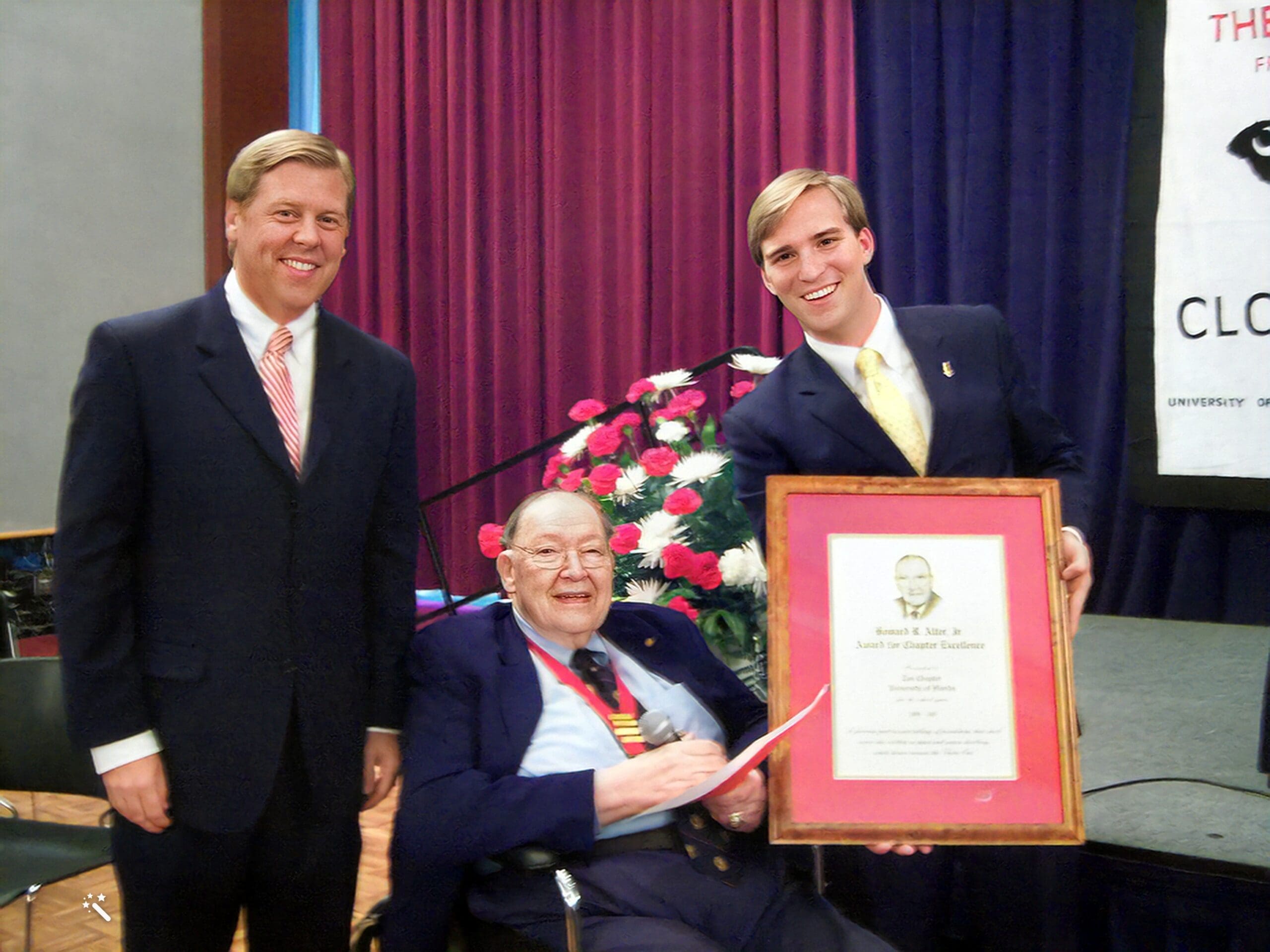 Three men celebrating an award presentation ceremony.