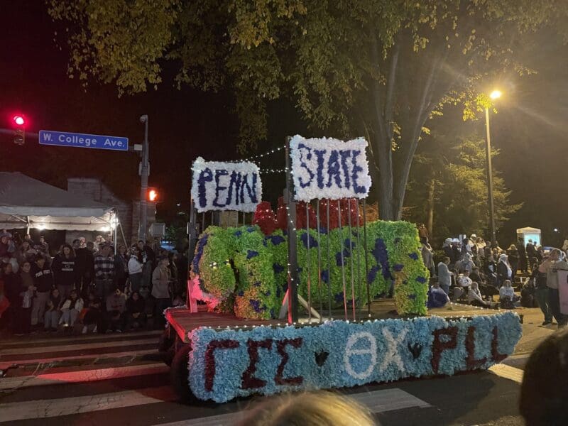 Penn State parade float decorated with flowers.