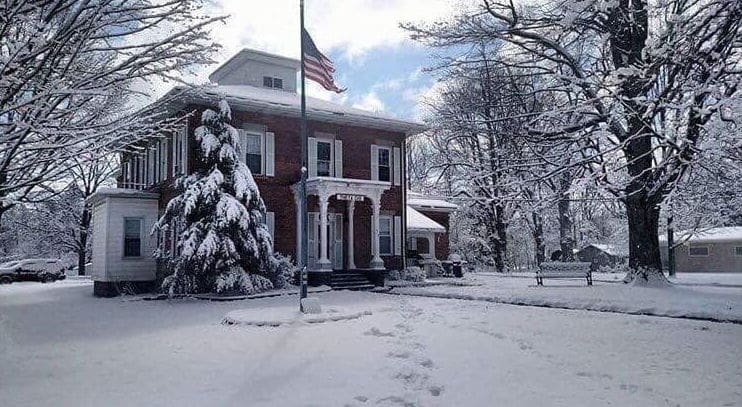 Historic building covered in fresh snow.