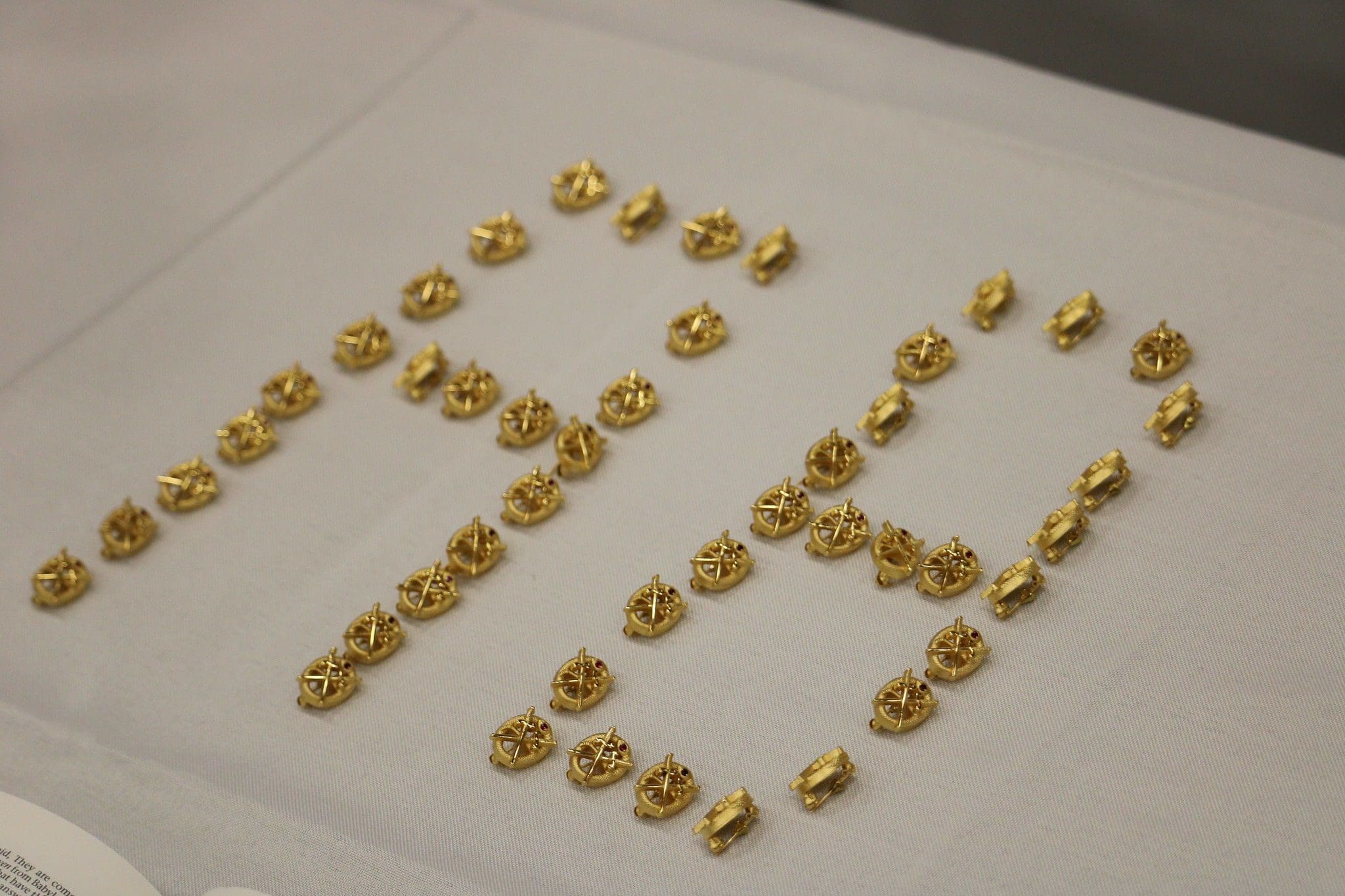 Golden decorative items arranged in a creative pattern.