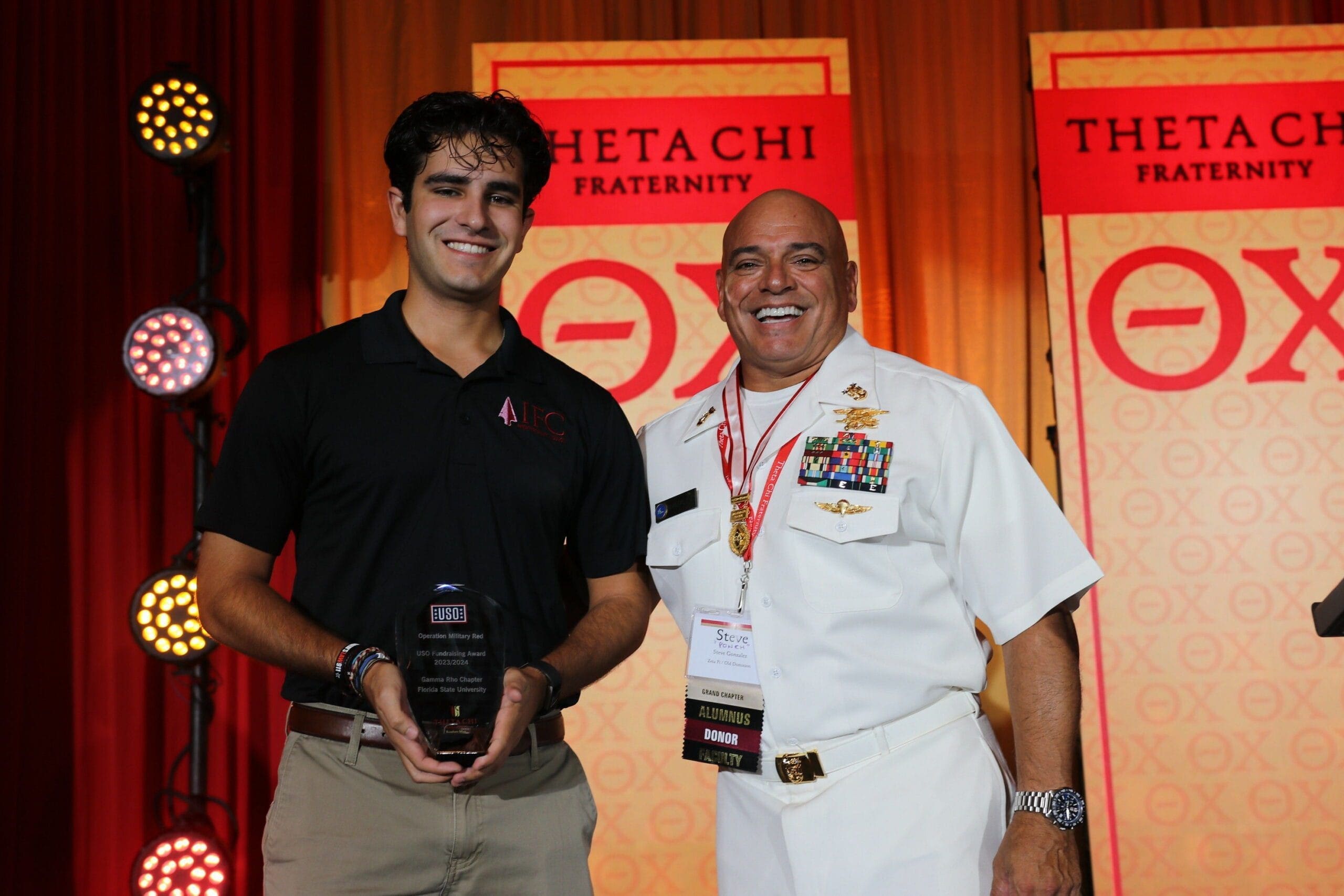 Award presentation at Theta Chi fraternity event.