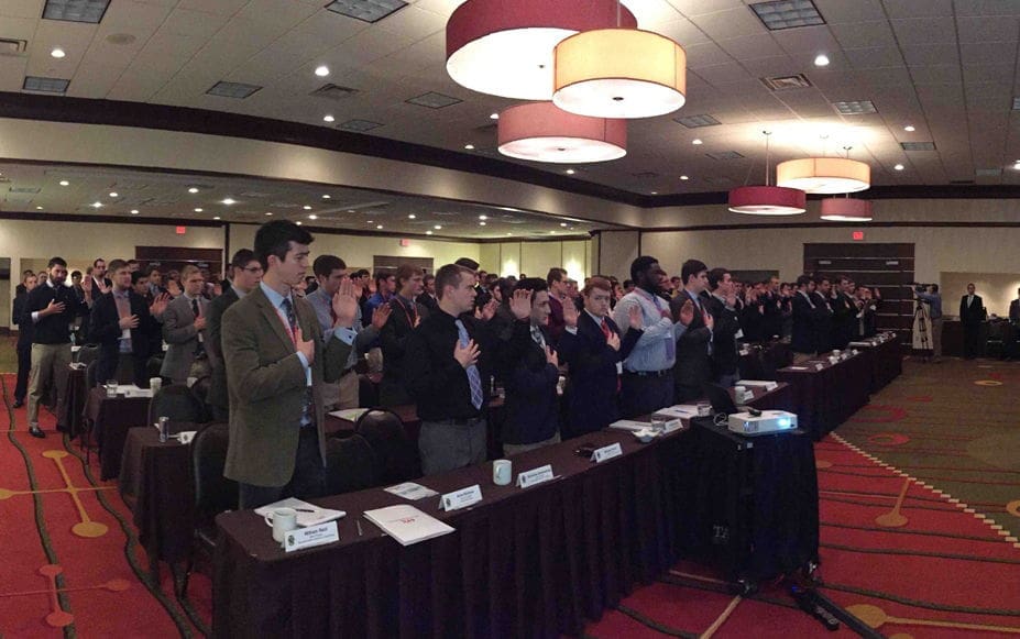 Audience members participating in a conference event.