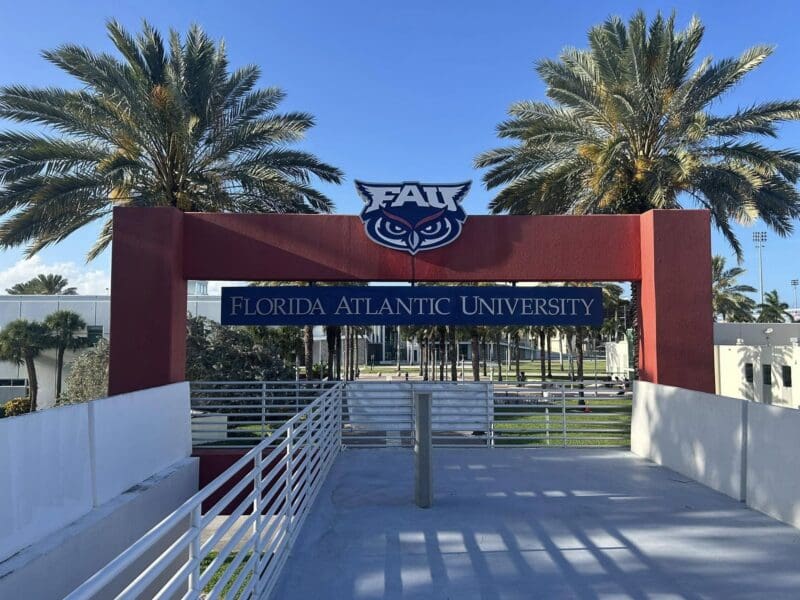 Florida Atlantic University entrance with palm trees.