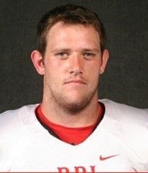 Football player in team jersey portrait.