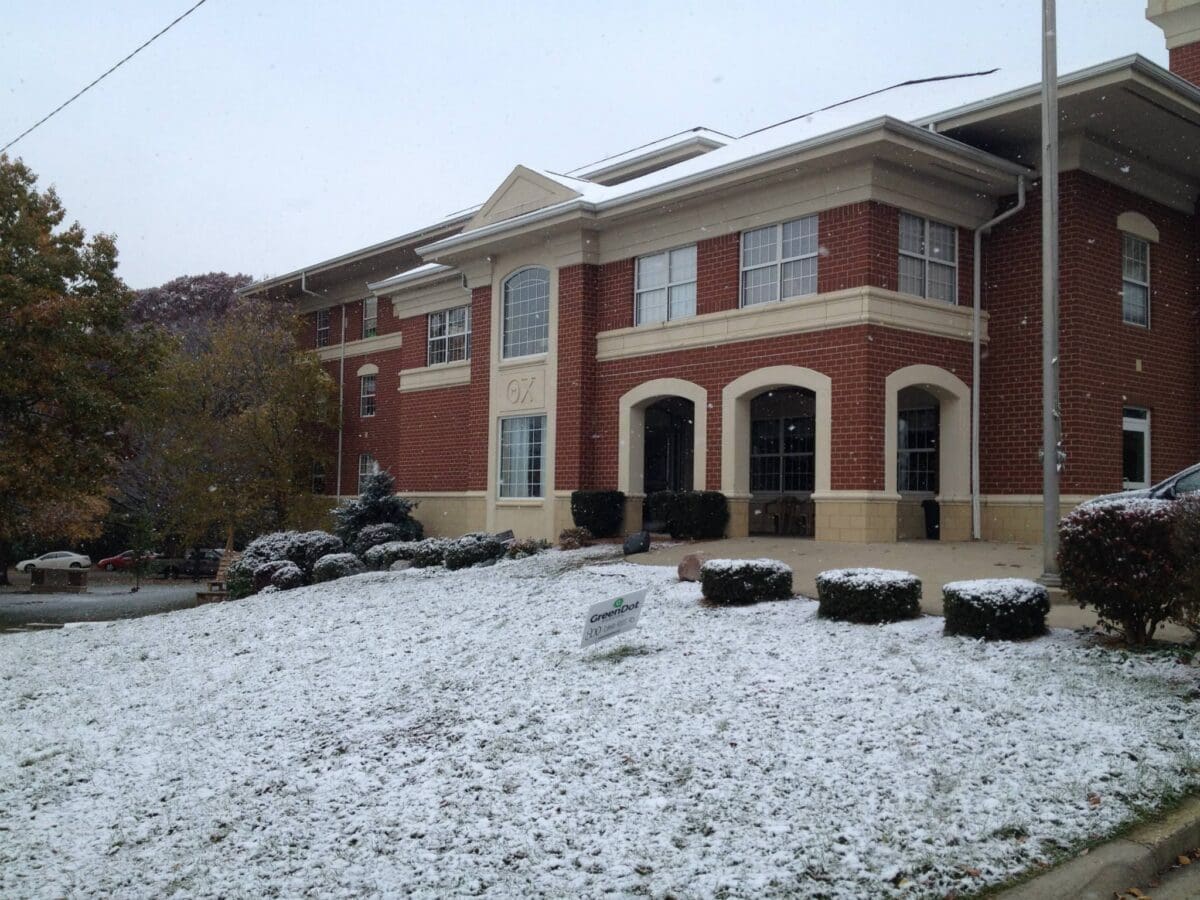 Brick building covered in snow during winter.