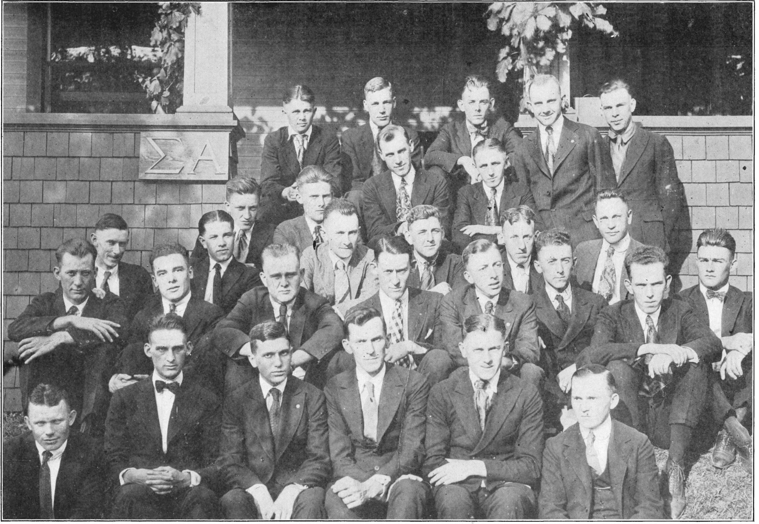 Group photo of young men in suits, early 20th century.