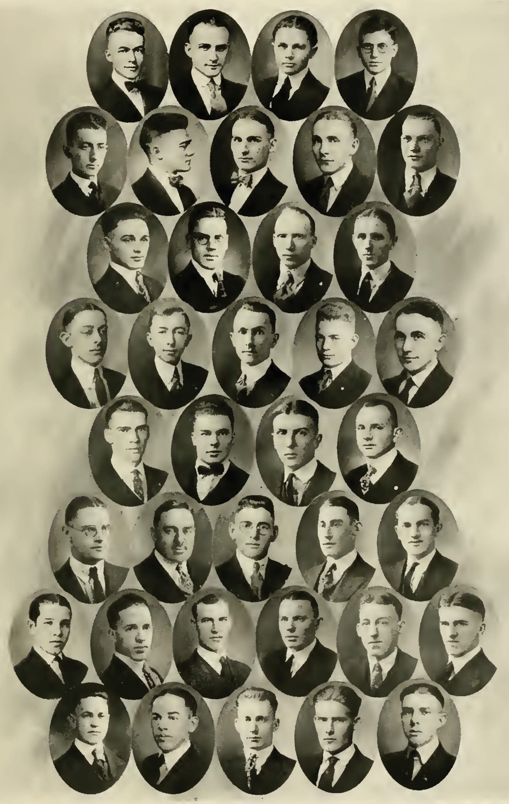 Historical group portrait of young men in suits.