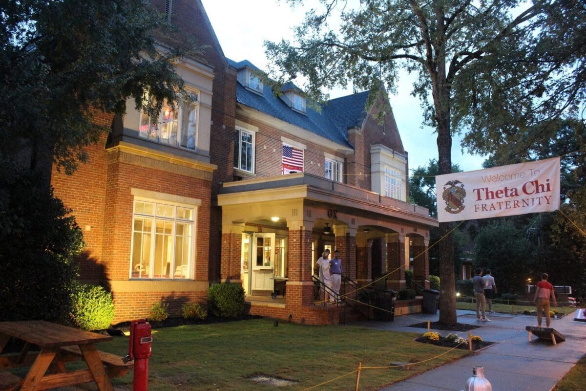 Theta Chi fraternity house with welcoming banner.