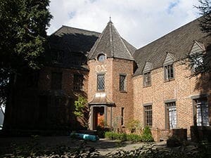 Historic brick mansion with unique architectural features.