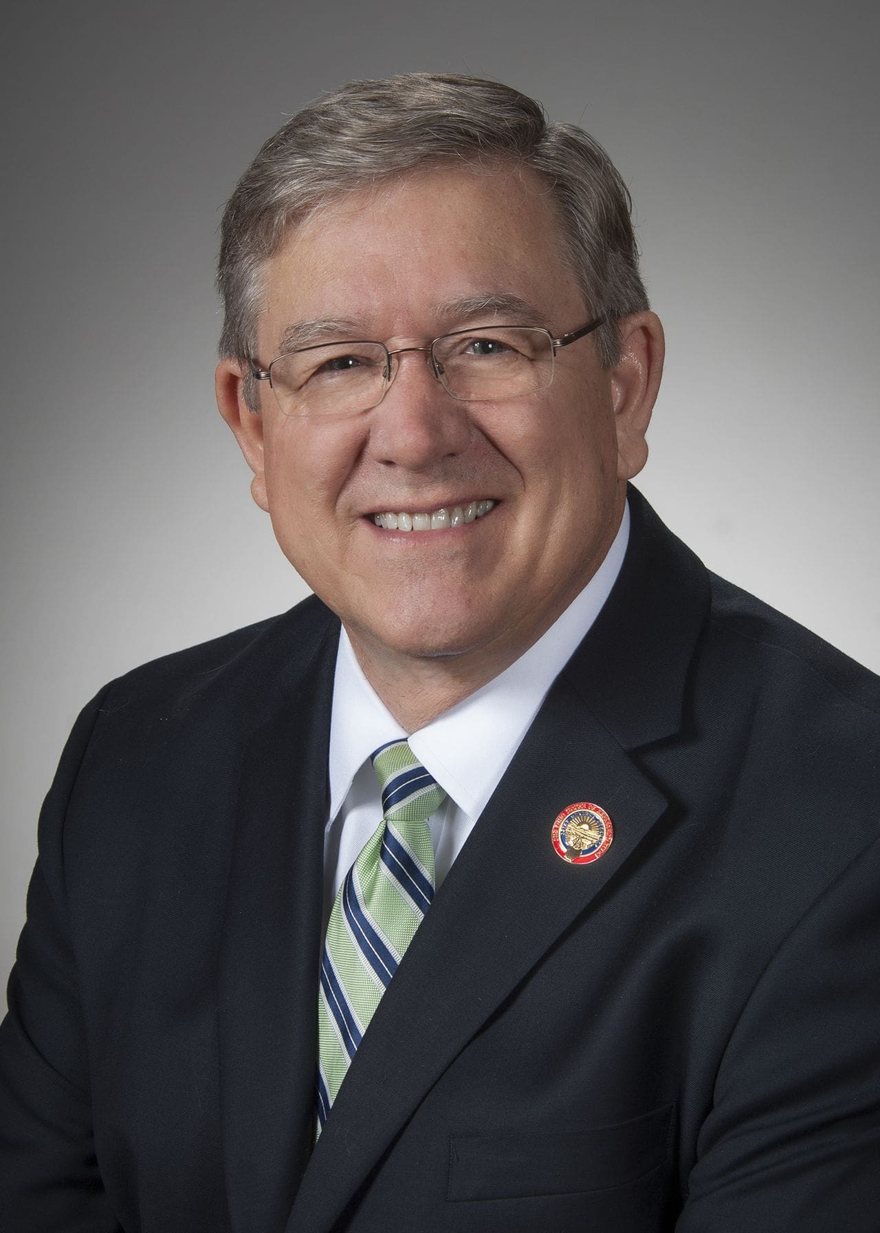Bob Cupp Professional headshot of a smiling man in a suit.