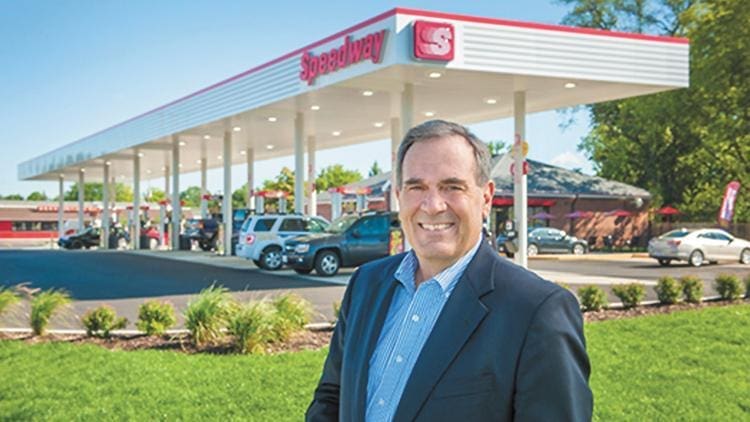 Businessman in front of Speedway gas station.