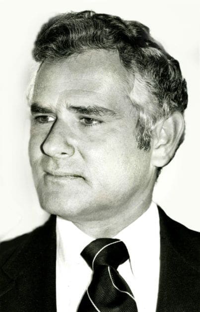 Black and white portrait of a middle-aged man.
