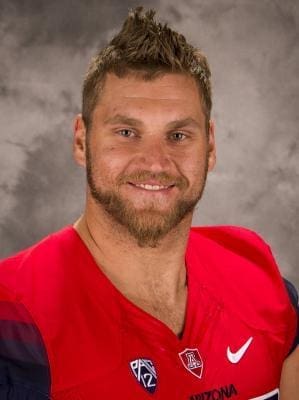 Arizona football player in team jersey portrait.