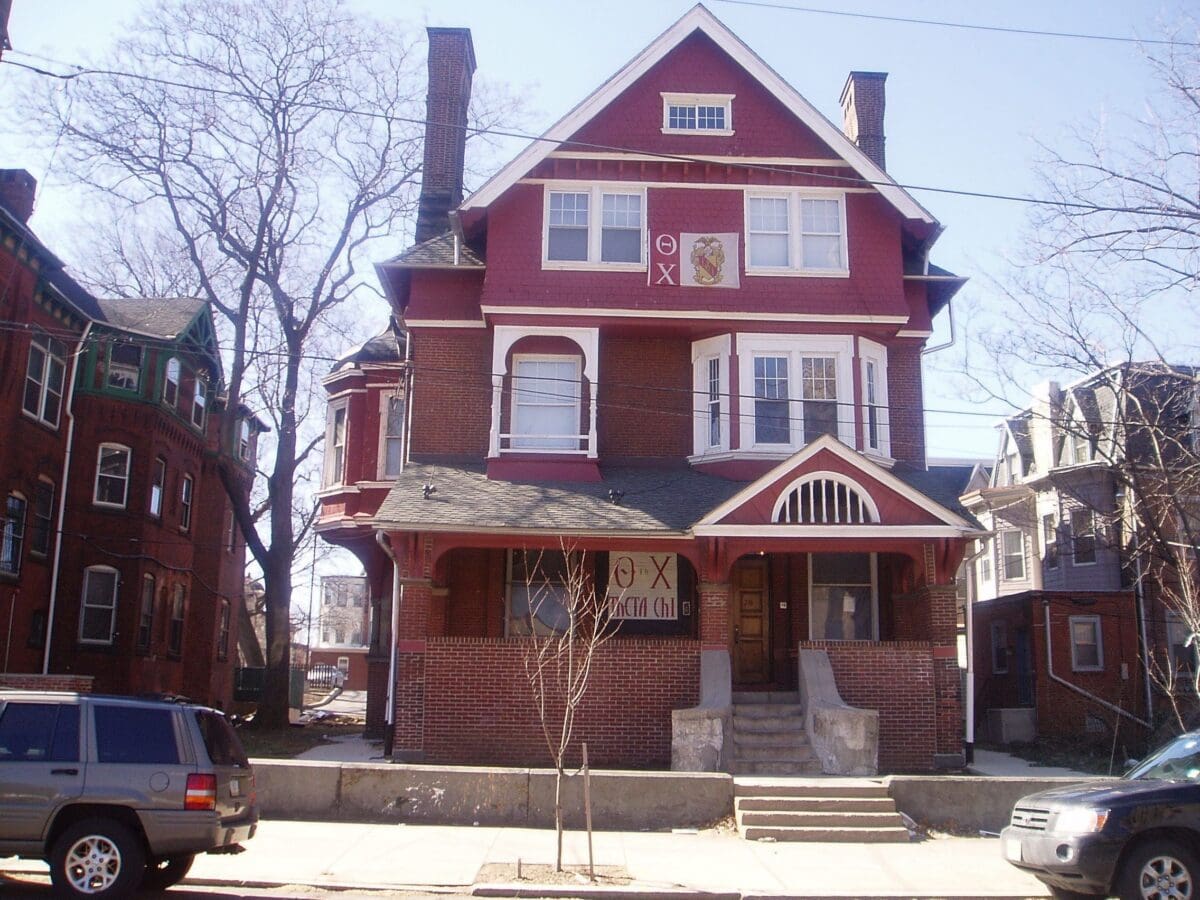 Historic red brick Victorian house exterior view.