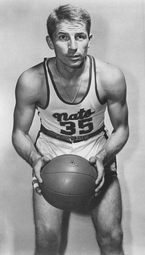 Vintage basketball player holding a ball, jersey number 35.