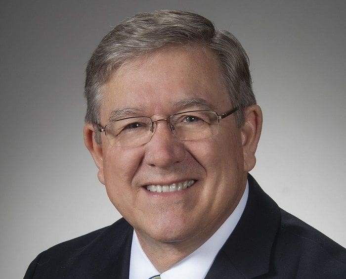 Bob Cupp Professional man smiling in formal attire.