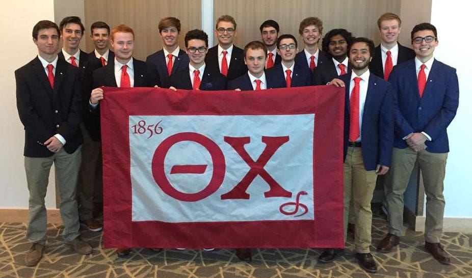 Boulder Colonization - 2018 Group of fraternity members holding a flag.