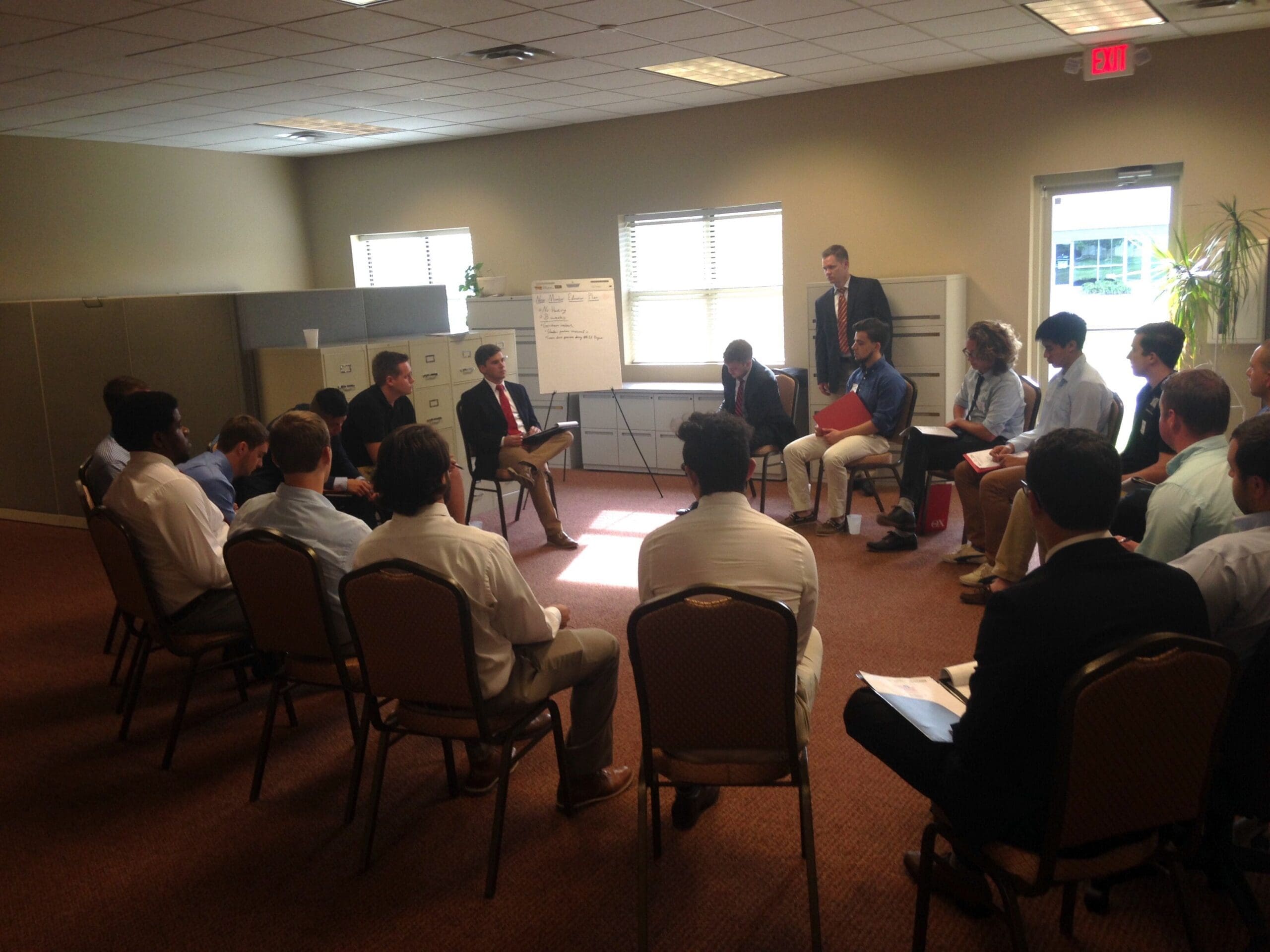Group discussion in a conference room setting.