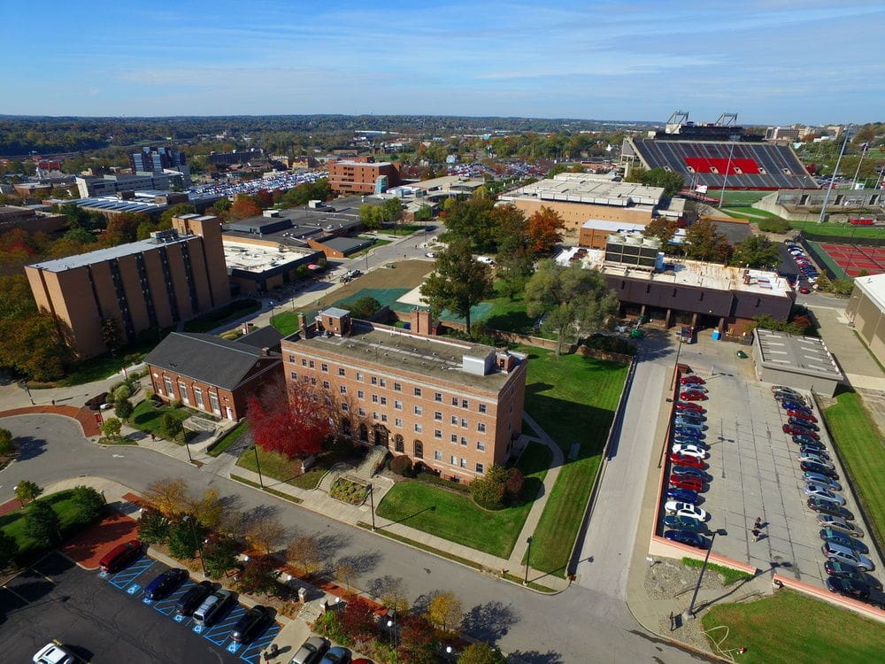 Aerial view of university campus with parking lot.