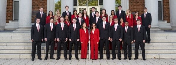 Group photo of students in red and black attire.