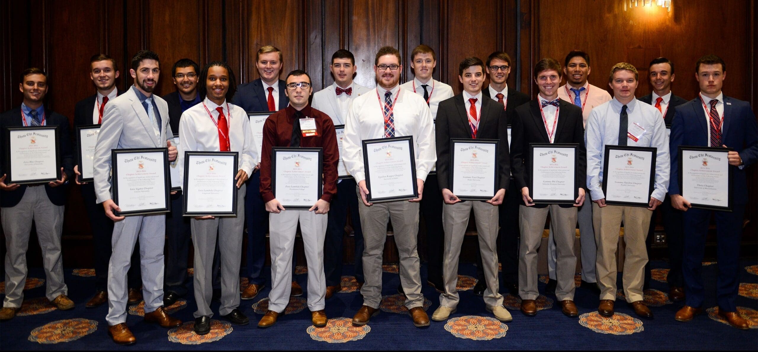 Students celebrating awards at formal event.