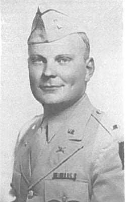 Military officer portrait in uniform, historical photograph.