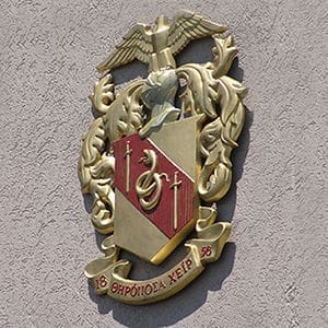Coat of arms featuring eagle and swords design.
