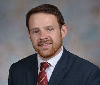 Colin Ogle Professional man in suit and tie portrait.