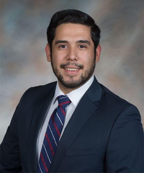 Professional man in suit with a friendly smile.