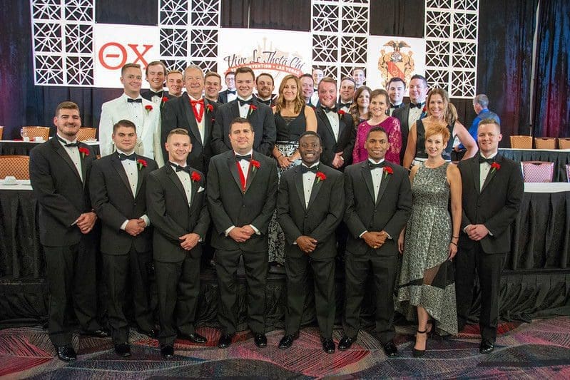 Formal group photo at a gala event.