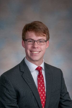 Smiling young man in suit and tie portrait.