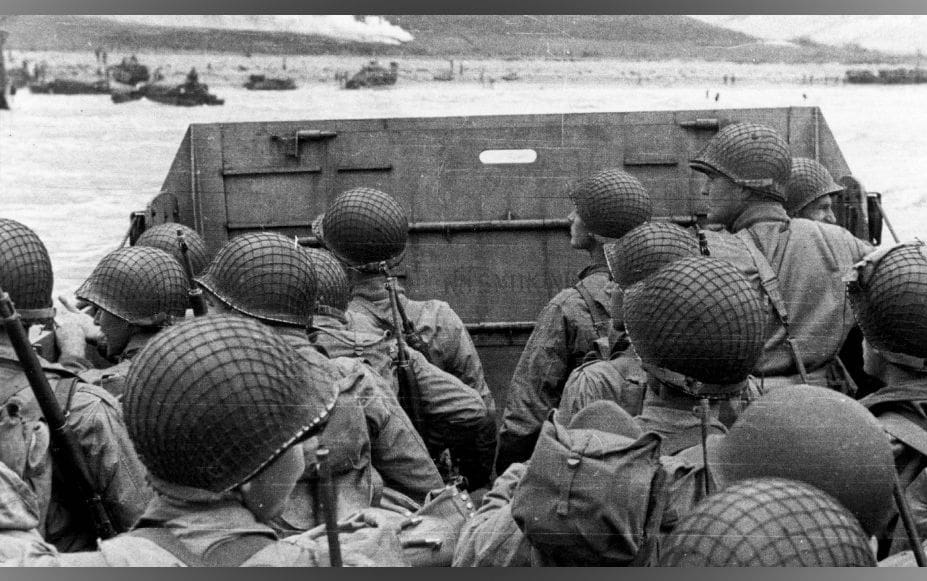 Soldiers preparing to disembark from landing craft.
