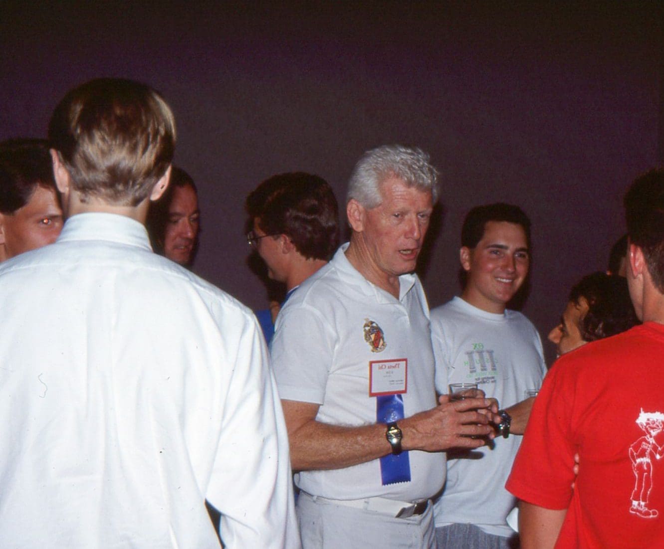 Don Fine talking with collegians Don Fine talking with collegians