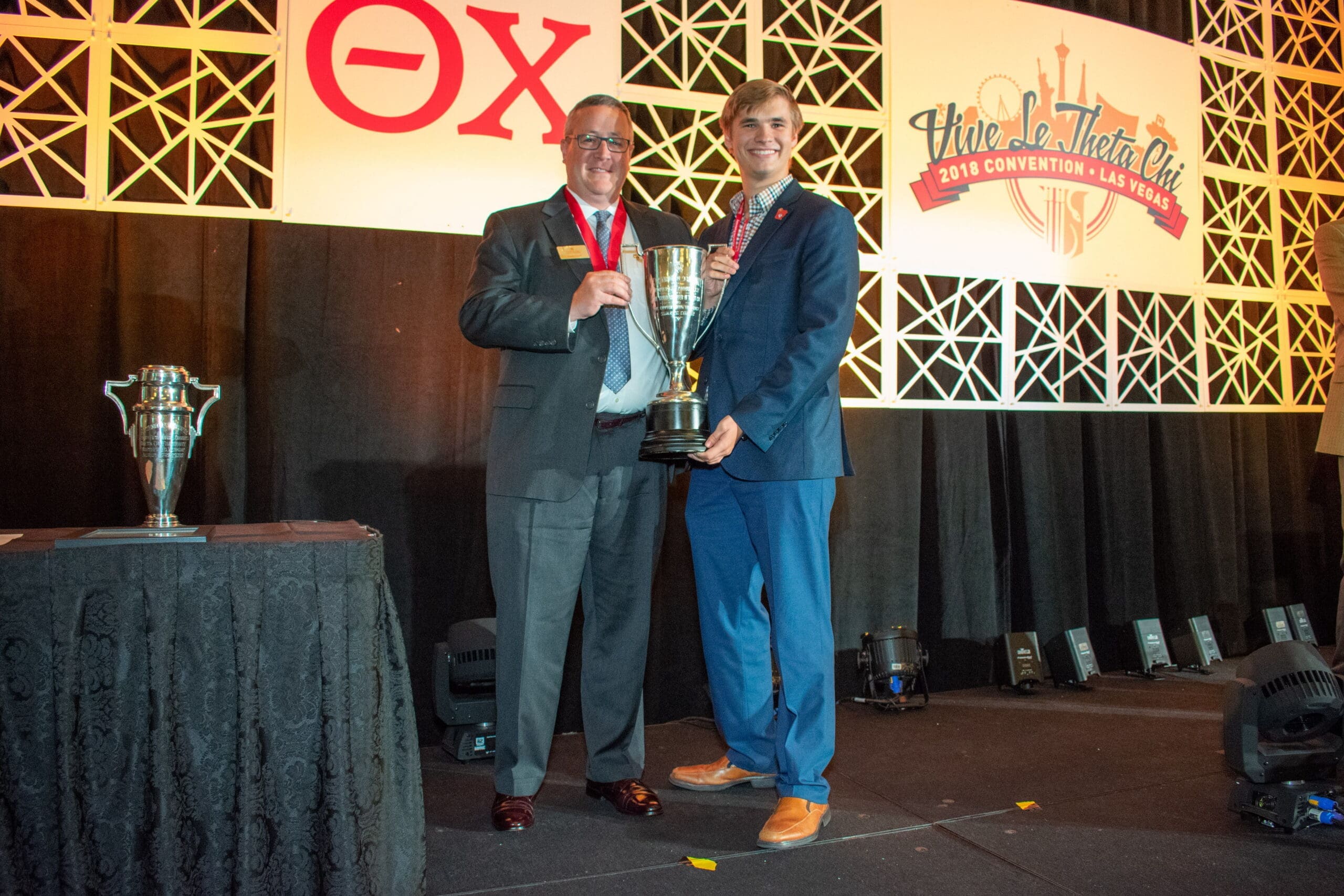 17/18 GC Scholarship Award (2) Award presentation at convention ceremony with trophy.