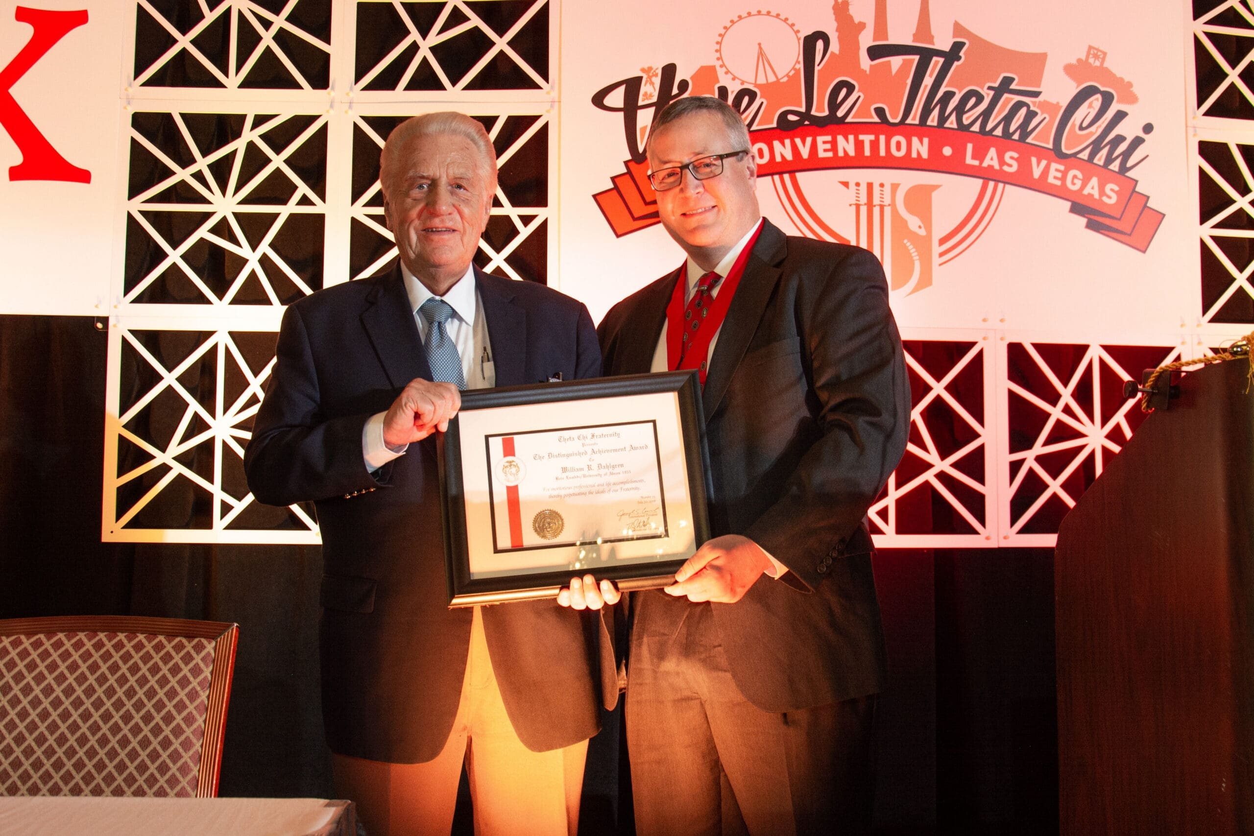 2018 DAA - Dahlgren Two men holding an award at a convention.