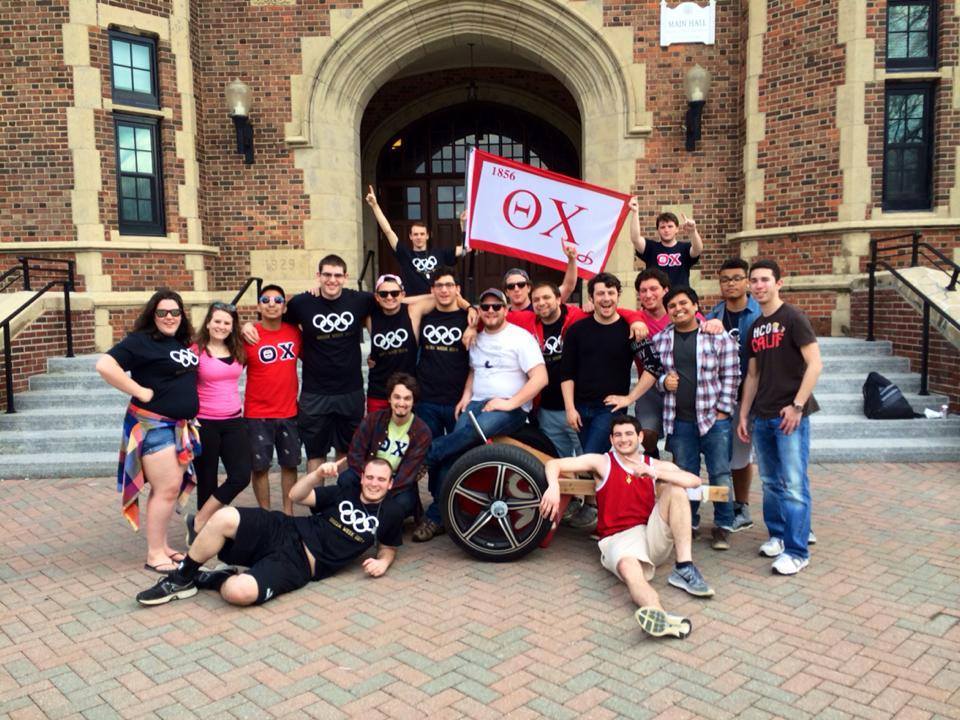 Group photo of students celebrating at university event.