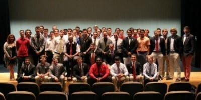 Group photo of students in formal attire.