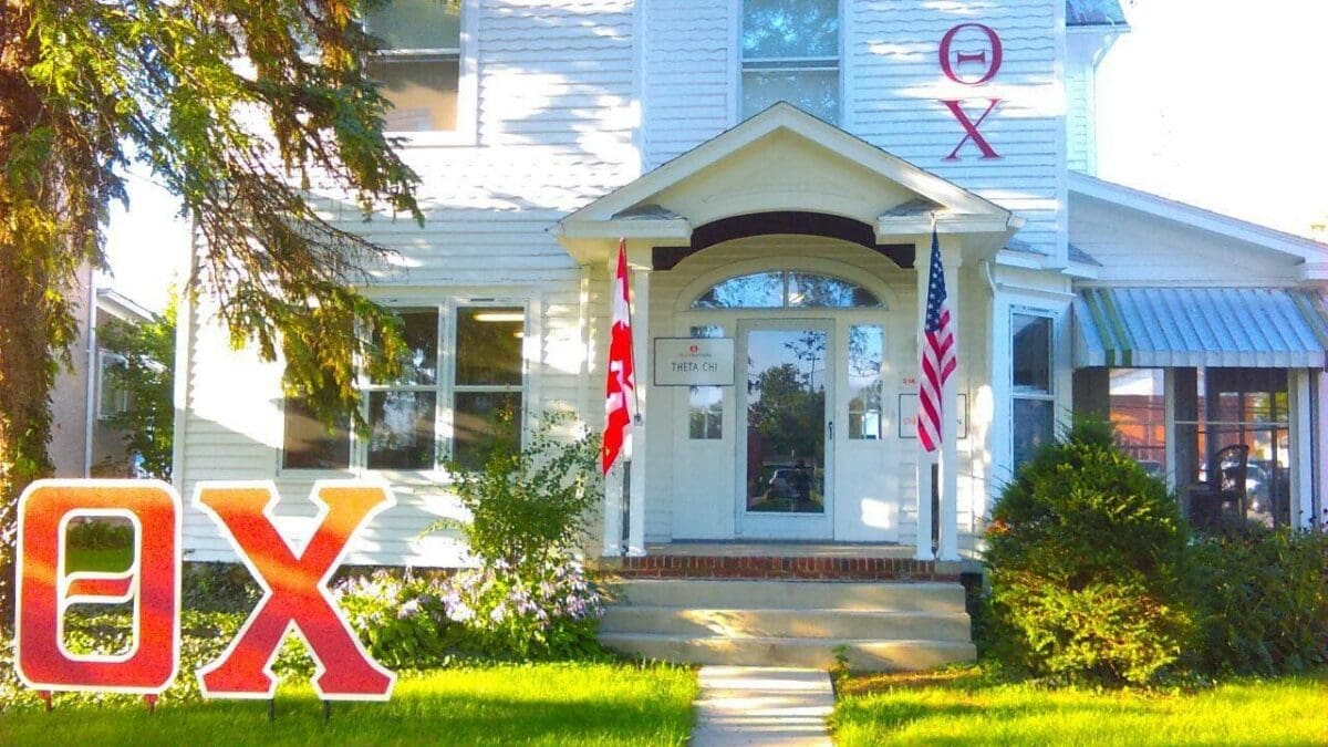 Historic building with flags and welcoming entrance.
