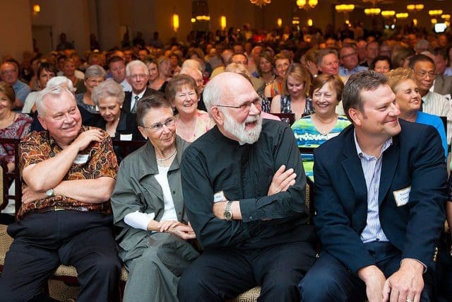 Audience laughing at a live comedy event.