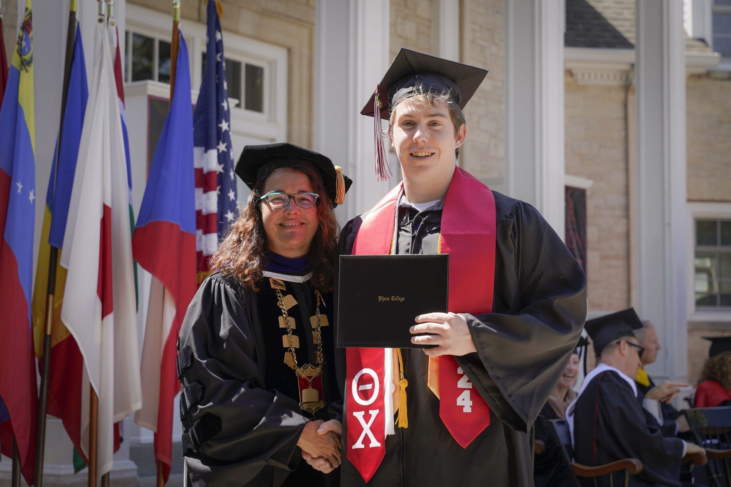 Graduation ceremony with proud students and faculty.