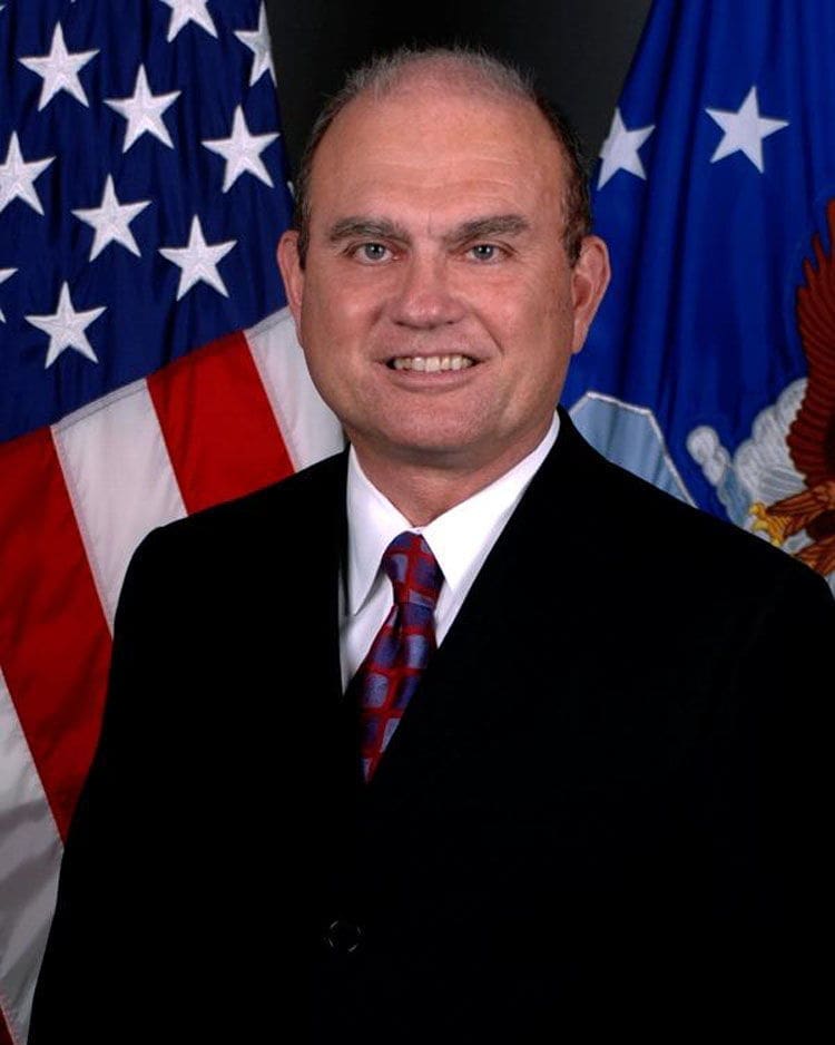 Official portrait with American flag background.