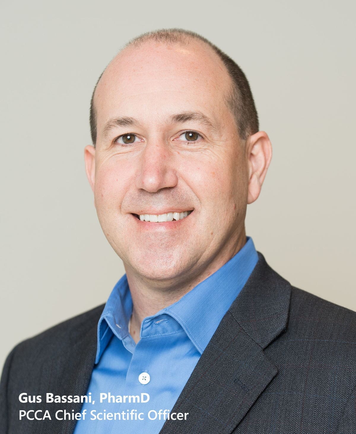 Professional man in a suit smiling for portrait.