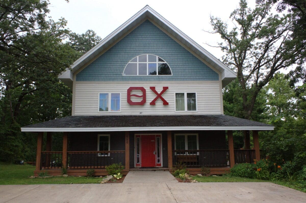 Modern house with unique architecture and vibrant signage.