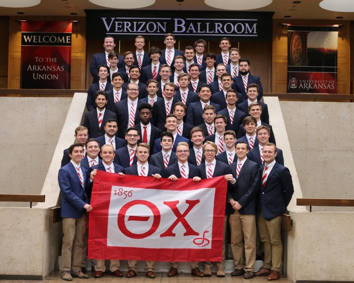 Group photo of fraternity members at Verizon Ballroom.