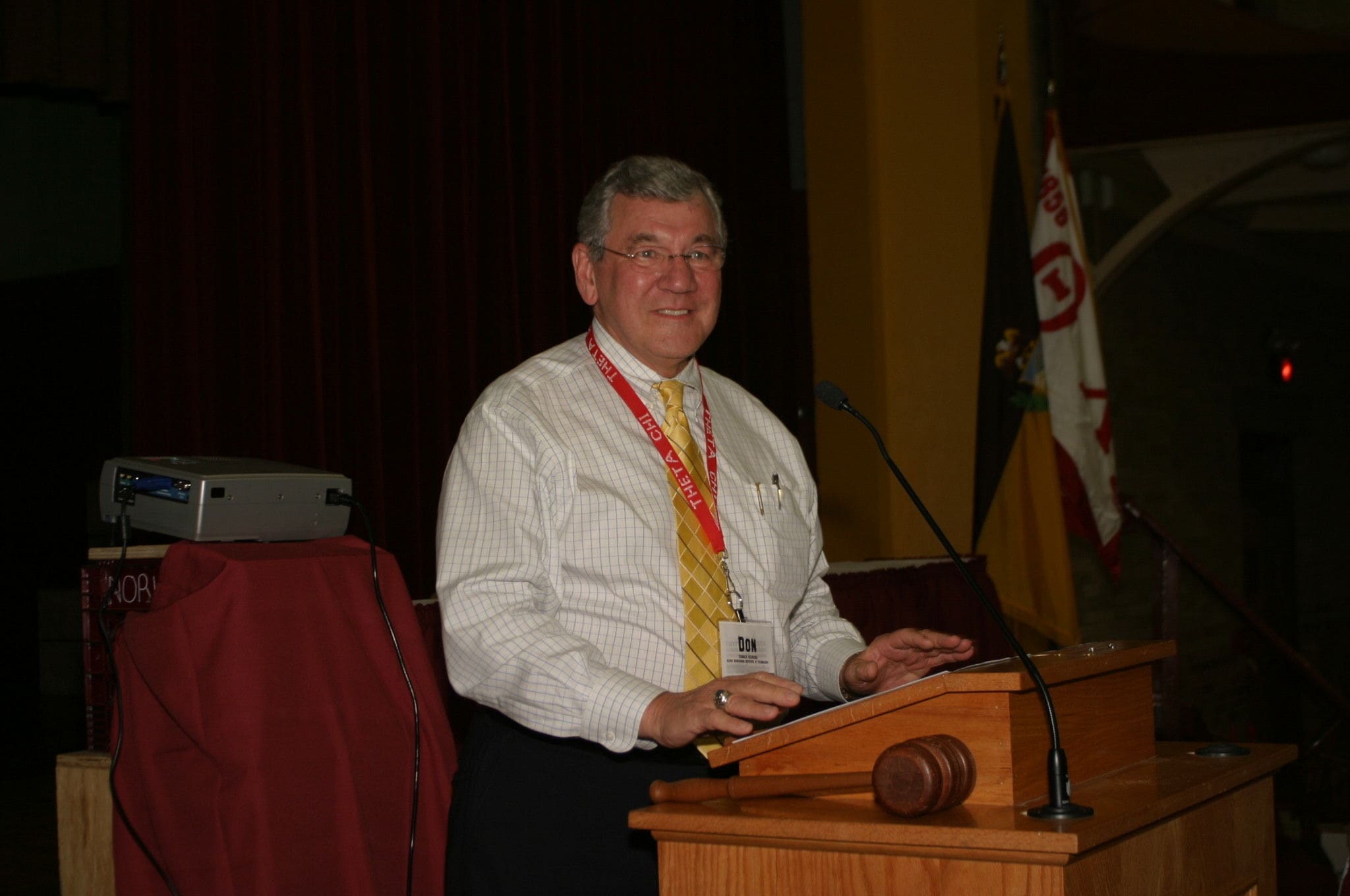 Gehring Man speaking at a podium during a conference.