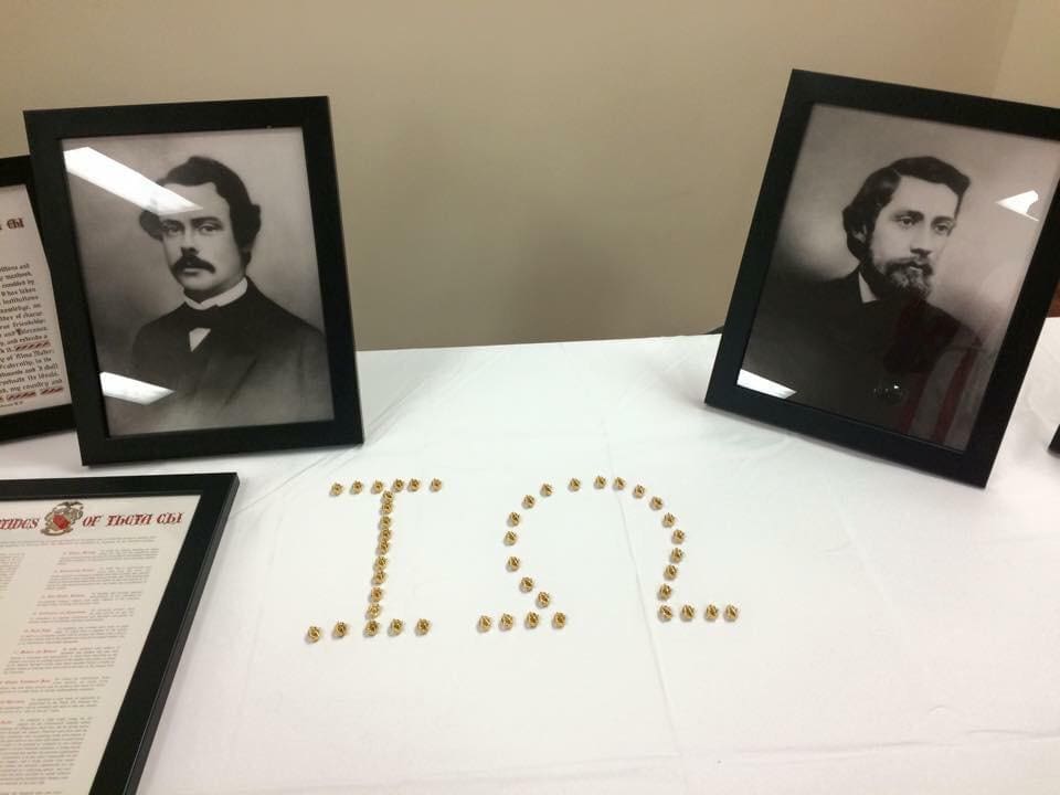 Historical display with portraits and coin arrangement.