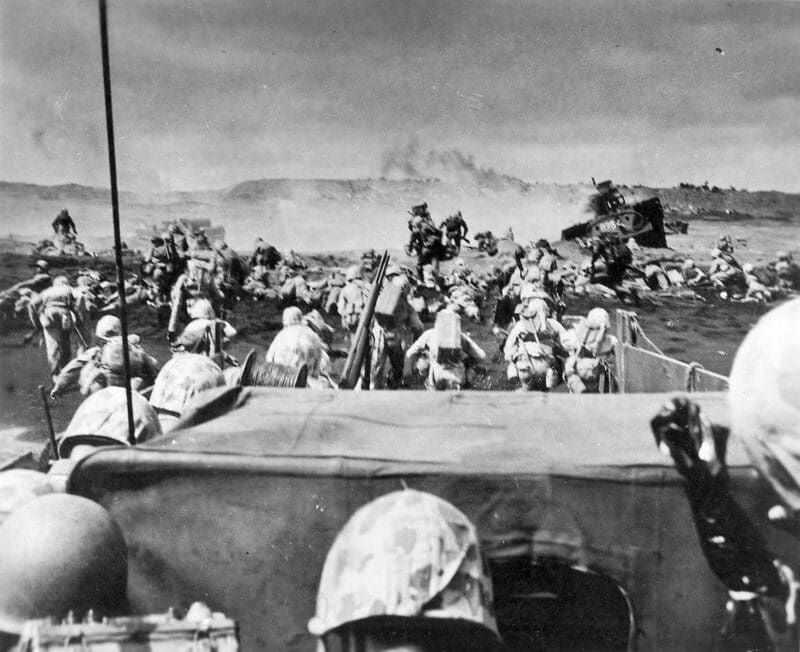 Soldiers landing on a beach during a historic battle.