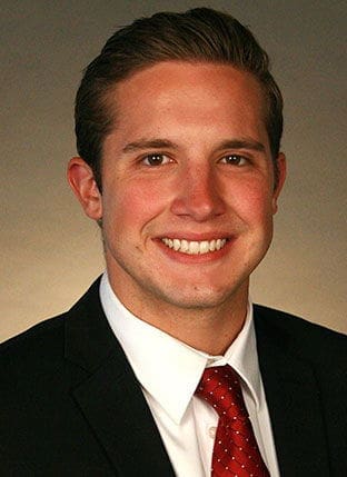 Smiling professional man in business suit portrait.